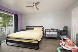 Bedroom featuring access to exterior, ceiling fan, and wood-type flooring