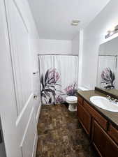 Bathroom featuring toilet and vanity