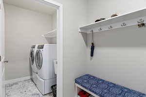 Clothes washing area with washer and dryer