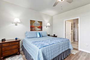 Bedroom featuring ceiling fan and light hardwood / wood-style floors