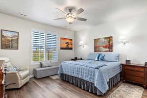 Bedroom with wood-type flooring and ceiling fan