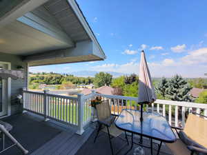 Wooden terrace featuring a mountain view