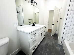 Bathroom with vanity and toilet