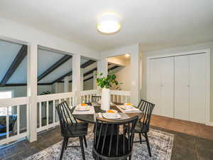 Dining room with beam ceiling