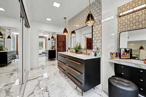 Bathroom with vanity and a shower with shower door