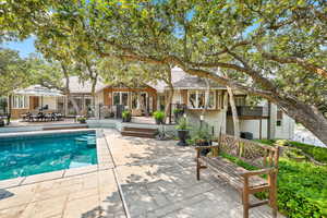 View of swimming pool featuring cooling unit, a patio area, and a deck