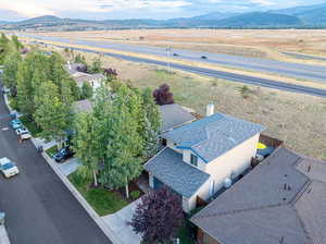 Birds eye view of property with a mountain view