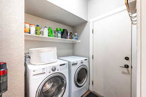 Laundry area featuring separate washer and dryer