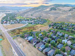 Aerial view at dusk featuring a mountain view