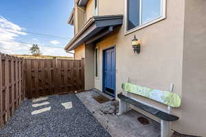 Entrance to property with a patio*Fence to be painted by HOA in 2025