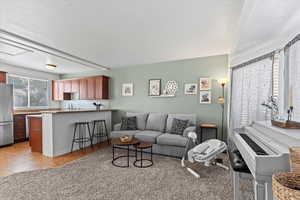 Living room featuring light tile patterned floors