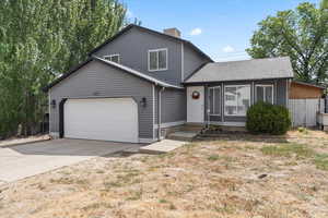 View of front of property featuring a garage