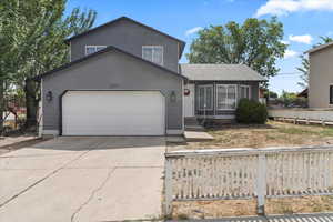 View of front of property featuring a garage