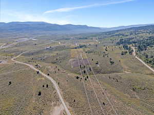 Birds eye view of property with a mountain view