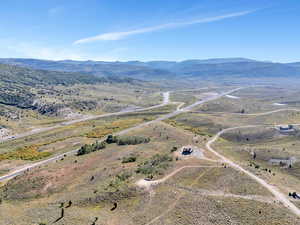 Birds eye view of property with a mountain view