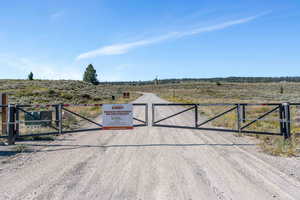 View of gate featuring a rural view