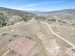 Birds eye view of property featuring a mountain view