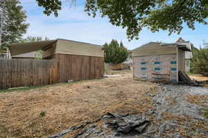 Exterior space featuring a storage unit