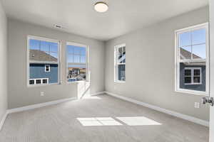 View of carpeted spare room