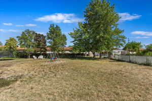 View of yard with a trampoline