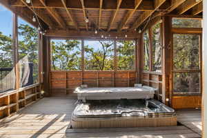 Screened deck with hot tub off Bedroom 2 on main level