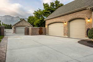 View of property exterior with a mountain view and a garage