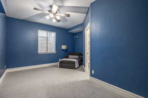 Unfurnished room with a textured ceiling, ceiling fan, and carpet