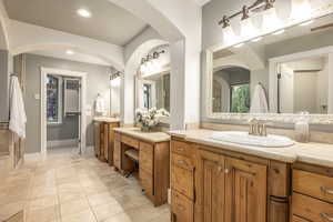 Bathroom with tile patterned flooring and vanity