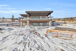 View of front of property featuring a balcony