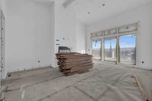 Living room featuring beam ceiling