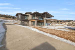 View of front of house featuring a balcony