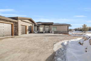 Prairie-style house with a garage