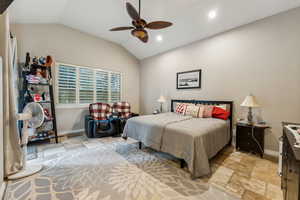 Primary Bedroom featuring lofted ceiling and ceiling fan