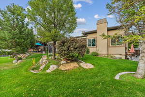 View of backyard featuring a playground