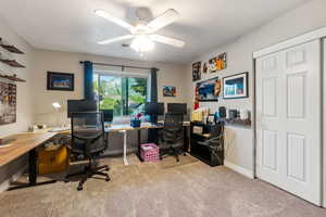 Bedroom with light colored carpet and ceiling fan