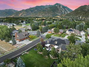 Aerial view at dusk featuring a mountain view