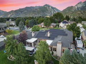 Exterior space featuring a mountain view. Solar panels