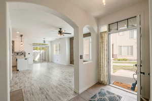 Entry door and view onto Livingroom, dining area and kitchen