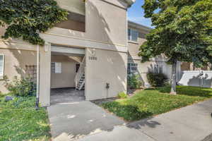 Property entrance with a lawn main level entrance.