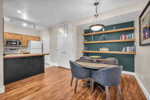 Dining area with light wood-type flooring