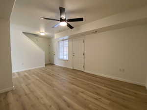 Unfurnished room featuring light hardwood / wood-style flooring and ceiling fan