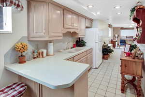 Wet bar, full kitchen cabinets & fridge