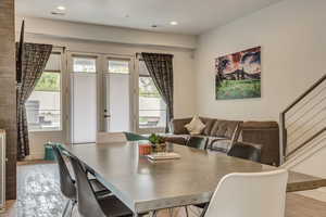 Dining area with light hardwood / wood-style floors