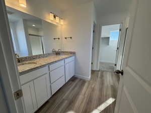 Primary Bath featuring double sinks