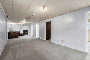 Unfurnished living room featuring carpet