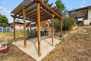 View of patio featuring a pergola