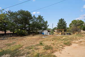 View of yard featuring a storage unit