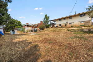 View of yard featuring a storage unit