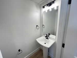 Bathroom with wood-type flooring