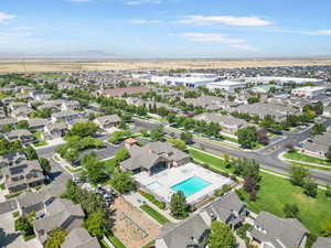 Arial View of Clubhouse 1 featuring playground, pool and spas.